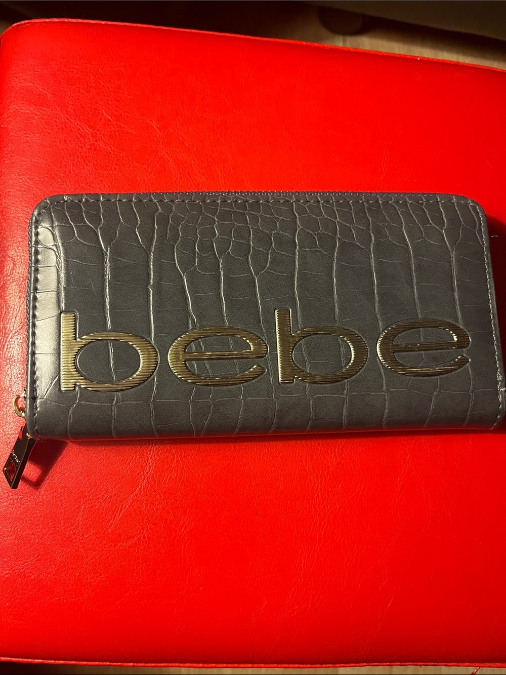 Bebe Fabiola crocodile-embossed zip-around wallet